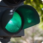 An illuminated green traffic light